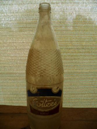 Vintage old glass bottle Cottees soft drink