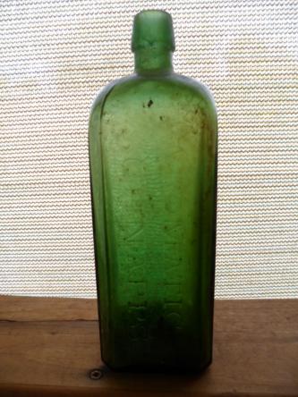 Vintage old green glass bottle